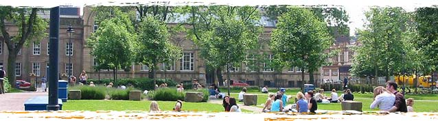Photograph of people sitting around in All Saint's Park