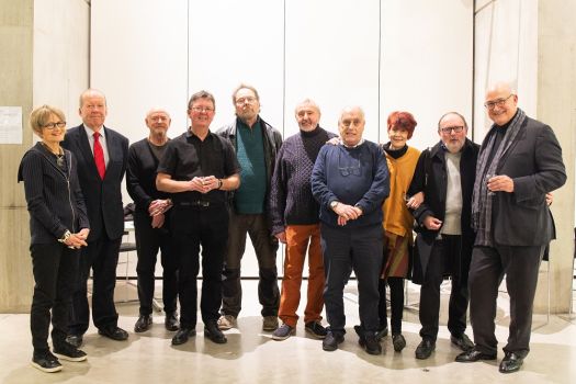 A group of Manchester School of Art alumni from 1969 who gathered for a 50th anniversay exhibition in the Benzie Building